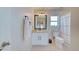 Clean bathroom with white vanity, single sink, and shower/tub combo at 13267 Linzia Ln, Spring Hill, FL 34609