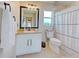 Clean bathroom with white vanity, single sink, and shower/tub combo at 13267 Linzia Ln, Spring Hill, FL 34609