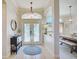 Spacious entryway with tile floor and decorative console table at 13267 Linzia Ln, Spring Hill, FL 34609