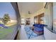Relaxing screened porch with patio furniture and a view of the backyard at 13267 Linzia Ln, Spring Hill, FL 34609