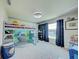 bedroom with built-in bunk beds and workspace at 13267 Linzia Ln, Spring Hill, FL 34609