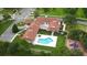 Aerial view of community clubhouse, pool, playground, and parking at 13267 Linzia Ln, Spring Hill, FL 34609