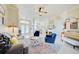 Open living room with seating area, fireplace, and a view to the dining area at 13267 Linzia Ln, Spring Hill, FL 34609