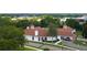 Aerial view of community clubhouse with red tile roof and surrounding landscape at 13267 Linzia Ln, Spring Hill, FL 34609