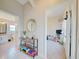 Bright hallway with built-in storage and access to bathroom and bedroom at 13267 Linzia Ln, Spring Hill, FL 34609