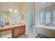 Bathroom with double vanity and garden tub at 13267 Linzia Ln, Spring Hill, FL 34609