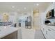 Spacious kitchen with white cabinets, granite countertops, and island at 13267 Linzia Ln, Spring Hill, FL 34609