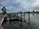 Waterfront property with a wooden boat dock and calm water at 11480 4Th E St, Treasure Island, FL 33706