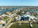 Aerial view of canal front home and neighborhood at 11480 4Th E St, Treasure Island, FL 33706