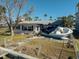 Damaged home with boat on the lawn at 11480 4Th E St, Treasure Island, FL 33706