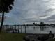 Serene view of a canal, boats, and waterfront homes at 11480 4Th E St, Treasure Island, FL 33706