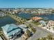 Aerial view of neighborhood with waterfront properties and construction at 11480 4Th E St, Treasure Island, FL 33706