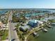 Aerial view showing a neighborhood with canals and waterfront homes under construction at 11480 4Th E St, Treasure Island, FL 33706