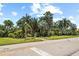 Landscaped park with tropical plants and paved walkway at 1120 North Shore Ne Dr # 201, St Petersburg, FL 33701