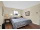 Comfortable bedroom with a king-size bed and wood flooring at 12400 Dearborn Dr # F, Hudson, FL 34667