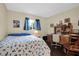 Bedroom with queen-size bed and built-in desk at 12400 Dearborn Dr # F, Hudson, FL 34667