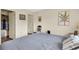 King-size bed, walk-in closet, and wood flooring at 12400 Dearborn Dr # F, Hudson, FL 34667