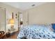 Cozy bedroom with a full-size bed and access to another room at 12400 Dearborn Dr # F, Hudson, FL 34667