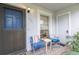 Cozy front porch with seating for relaxing at 12400 Dearborn Dr # F, Hudson, FL 34667