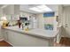 Clean and efficient kitchen with white cabinets and modern appliances at 12400 Dearborn Dr # F, Hudson, FL 34667