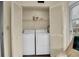 Convenient laundry closet with washer and dryer at 12400 Dearborn Dr # F, Hudson, FL 34667
