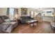 Spacious living room with hardwood floors and ample natural light at 12400 Dearborn Dr # F, Hudson, FL 34667