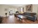 Bright living room features hardwood floors and access to a relaxing patio at 12400 Dearborn Dr # F, Hudson, FL 34667
