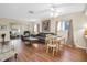 Open concept living and dining space with hardwood floors at 12400 Dearborn Dr # F, Hudson, FL 34667