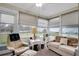 Relaxing sunroom featuring comfy seating and ample natural light at 12400 Dearborn Dr # F, Hudson, FL 34667