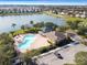 Aerial view of community pool and clubhouse near lake at 724 Griffen Heights Ct, Ruskin, FL 33570