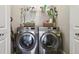 Convenient laundry room with side-by-side washer and dryer at 303 W North Bay St, Tampa, FL 33603