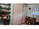 bedroom with built-in shelving and sliding closet doors at 10446 117Th Dr, Largo, FL 33773