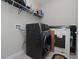 Laundry room with washer, dryer, and shelving at 10038 Corso Milano Dr, Tampa, FL 33625