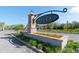 Community entrance with brick pillars and flower bed at 10038 Corso Milano Dr, Tampa, FL 33625