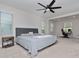 Large main bedroom with king-size bed and ensuite bathroom at 10038 Corso Milano Dr, Tampa, FL 33625