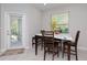Cozy breakfast nook with table and chairs near sliding door at 10038 Corso Milano Dr, Tampa, FL 33625