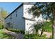 Two-story house with gray siding and brick walkway at 10038 Corso Milano Dr, Tampa, FL 33625