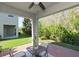 Covered patio with seating area and view of backyard at 10038 Corso Milano Dr, Tampa, FL 33625