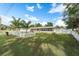 Charming ranch home with a fenced yard and mature landscaping at 7138 Fort King Rd, Zephyrhills, FL 33541