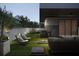 Modern rooftop terrace with outdoor kitchen and seating at 3217 Serenity Estates Ln, Tampa, FL 33611