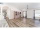 Living room with wood-look floors and a built-in cabinet at 1810 Raven Glen Dr, Ruskin, FL 33570