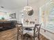 This dining area features a chandelier, marble table and wood floors at 14173 Pullman Dr, Spring Hill, FL 34609