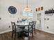 Bright dining area features wood floors and stylish light fixture near the doorway at 14173 Pullman Dr, Spring Hill, FL 34609
