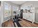 Exercise room with wood floors, natural light and fitness equipment at 14173 Pullman Dr, Spring Hill, FL 34609