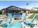 Outdoor fire pit surrounded by teal chairs, perfect for relaxing evenings at 14173 Pullman Dr, Spring Hill, FL 34609