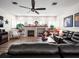 Spacious living room with a fireplace, built-in shelving, and comfortable seating at 14173 Pullman Dr, Spring Hill, FL 34609