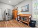 Pantry area with stainless steel refrigerator, wood floors, and natural light at 14173 Pullman Dr, Spring Hill, FL 34609