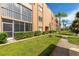 Building exterior with manicured landscaping and walkway at 1540 Glen Oaks E Dr # B134, Sarasota, FL 34232