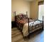 Comfortable bedroom featuring a queen bed with decorative pillows and side tables at 36822 Kay Ave, Zephyrhills, FL 33542