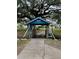 The Kissing Bridge under large oak trees provides a peaceful way to cross the water at 36822 Kay Ave, Zephyrhills, FL 33542